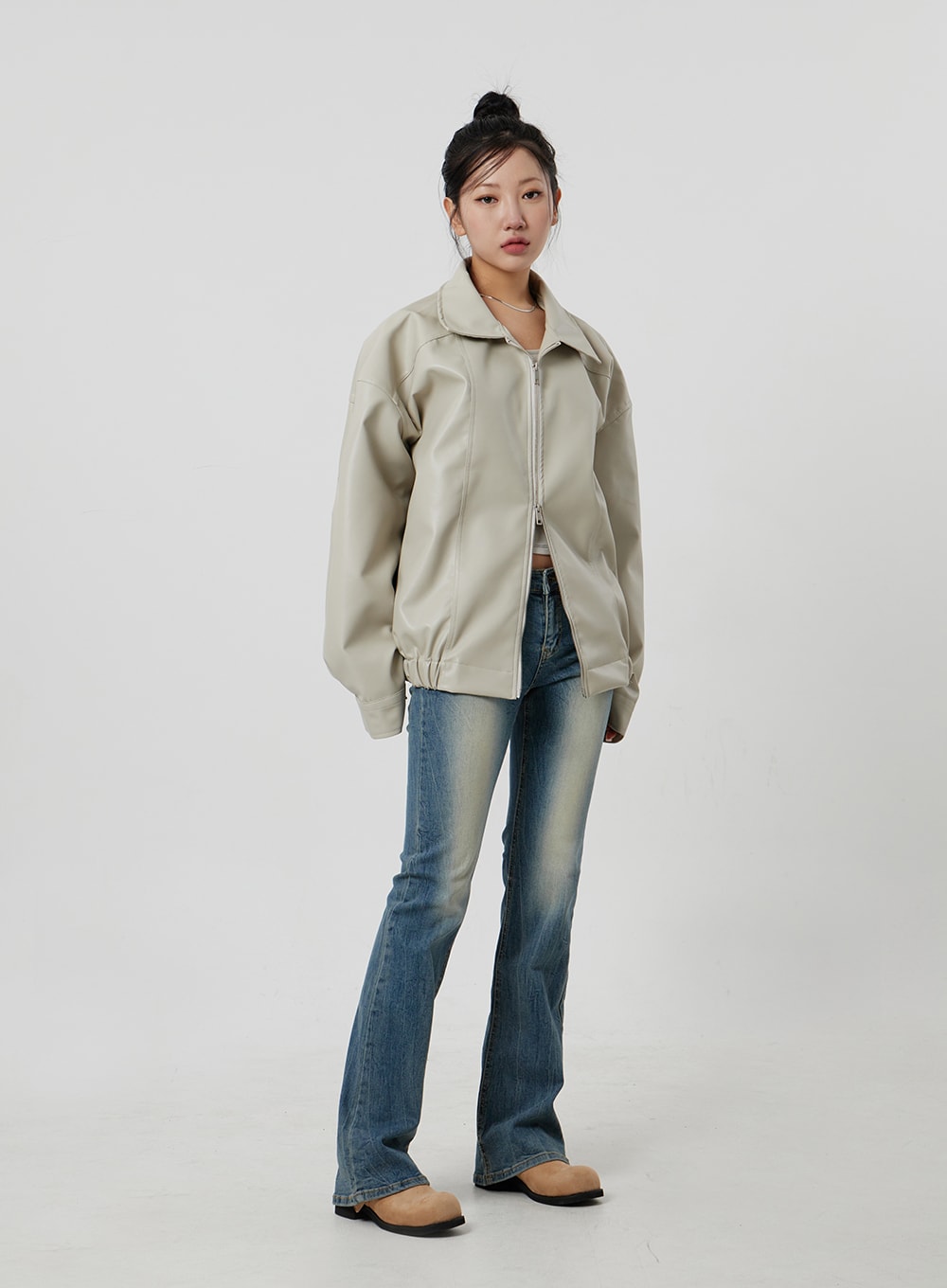 LEWKIN Low Rise Bootcut Jeans CF302 in blue, full-length front shot on model, slim-fit faded denim with bootcut flare, styled with beige leather zip jacket and tan loafers.