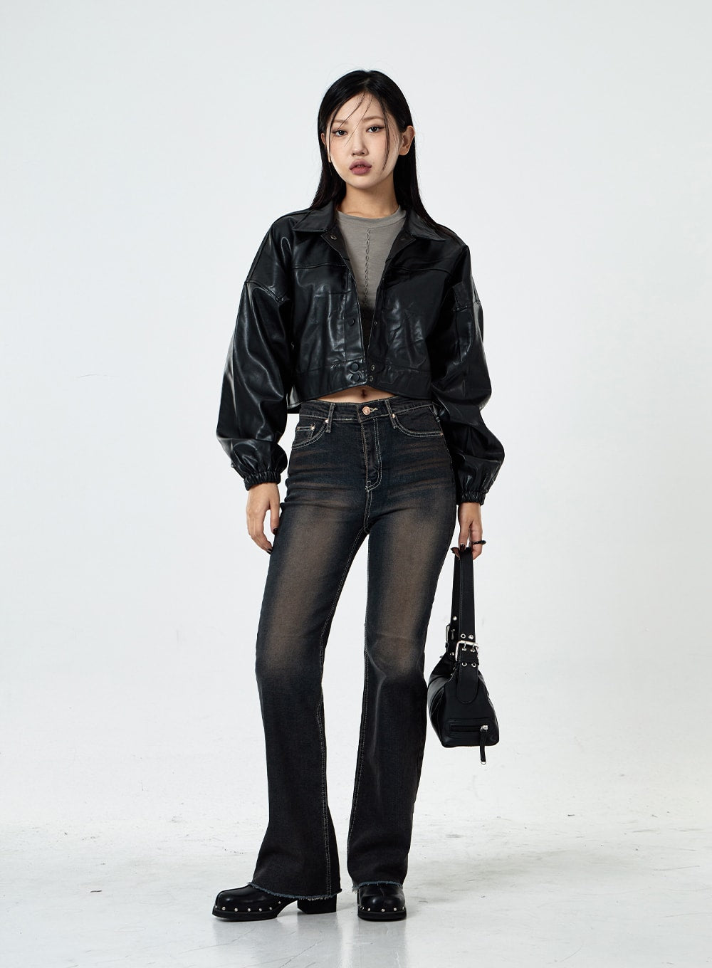 LEWKIN Basic Washed Bootcut Jeans CS07 in black washed denim, full-length front view on model, slim bootcut silhouette, high-waist, paired with crop leather jacket and black bag.