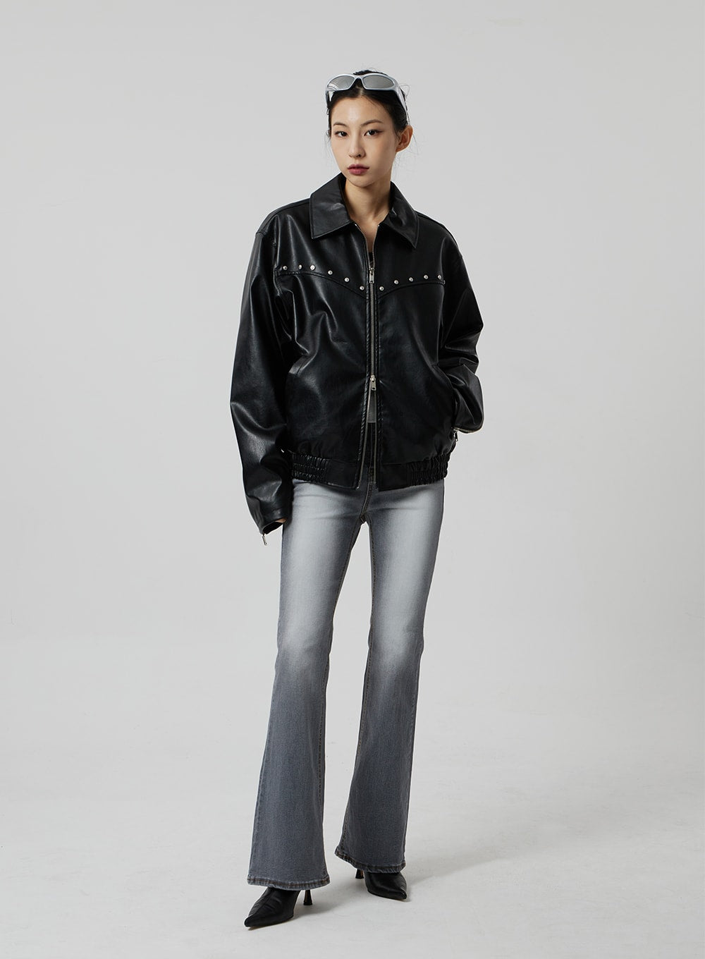 LEWKIN Slim Fit Bootcut Jeans CF307 in grey, full-length front view on model, slim-to-flare silhouette with washed finish, styled with black studded faux-leather jacket and kitten heels.
