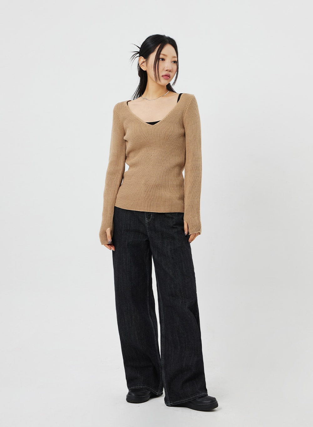 LEWKIN Straight Leg Jeans CF315 in black, full-body front on model, wide-fit cotton denim with contrast stitching, paired with camel ribbed knit sweater and black loafers.