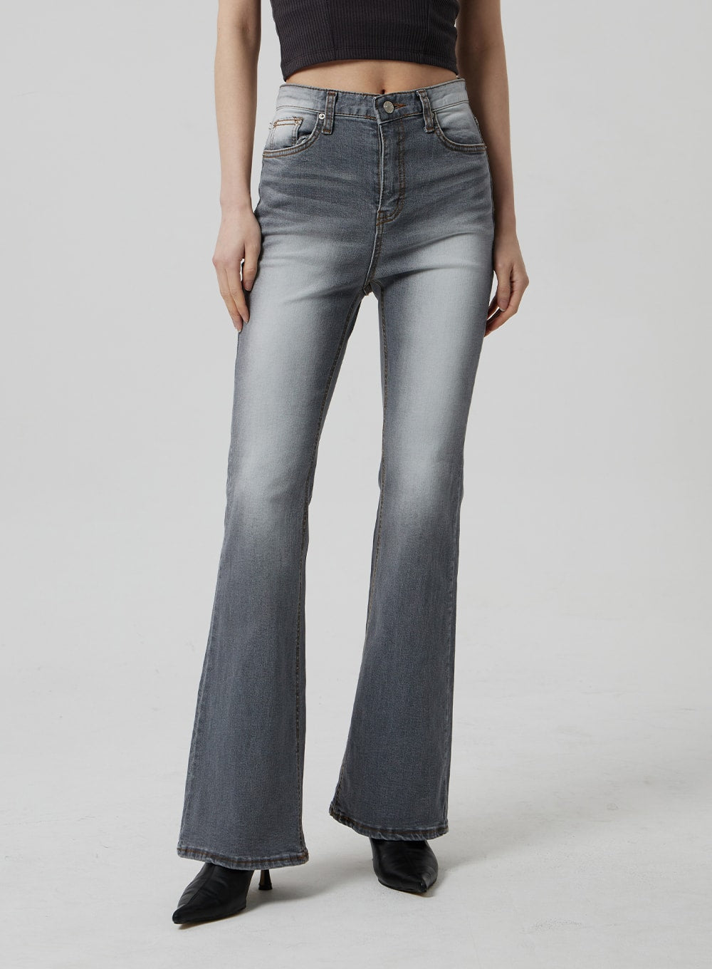 Slim Fit Bootcut Jeans CF307 in grey, front waist-to-hem close-up on model, high-rise with button fly, contrast stitching, and gradual bootcut flare, paired with dark crop top.