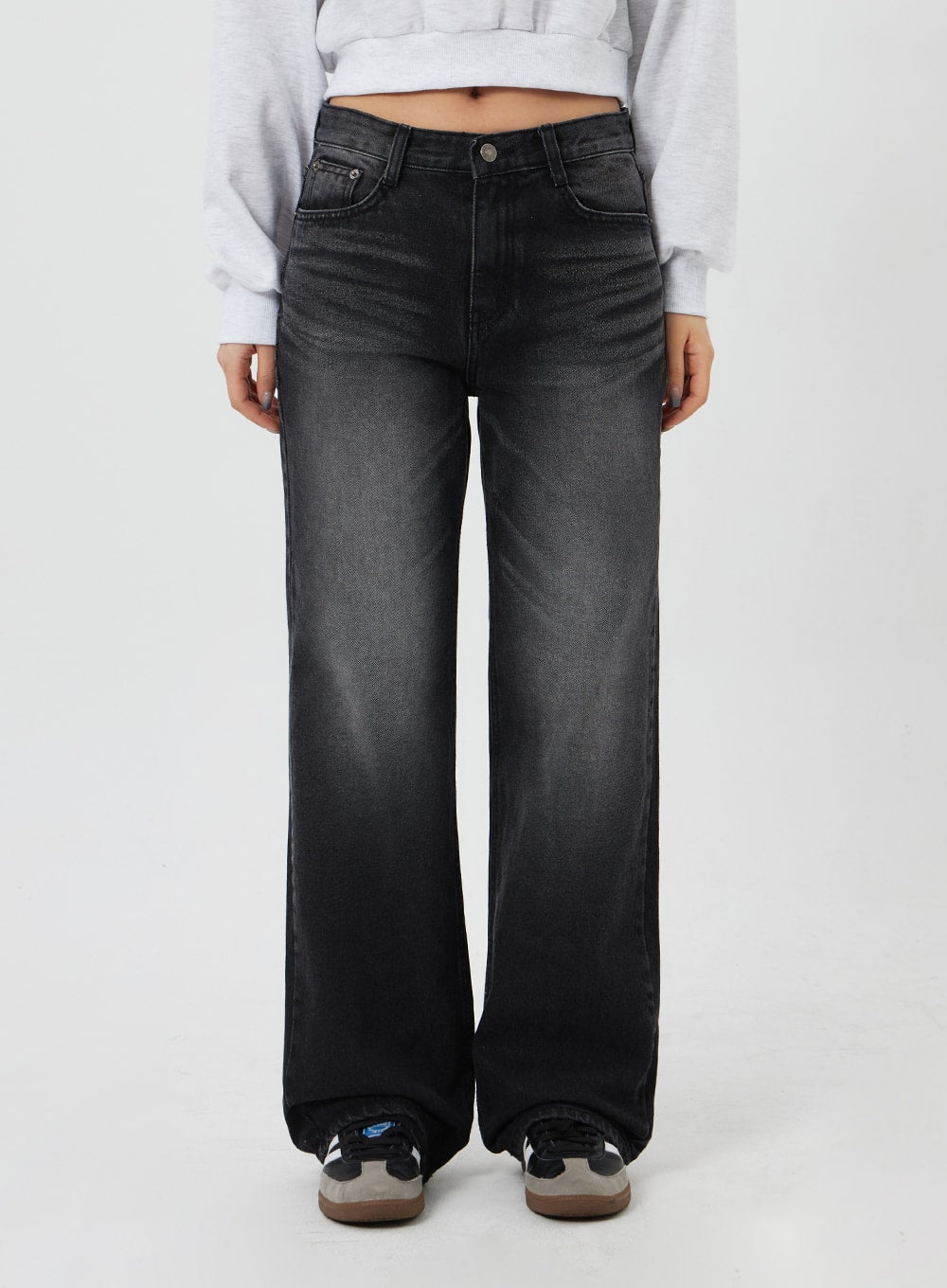 Mid-Rise Bootcut Jeans CF327 in black, front waist-to-hem close-up on model, mid-rise waistband with silver button, faded wide-leg cotton denim silhouette.