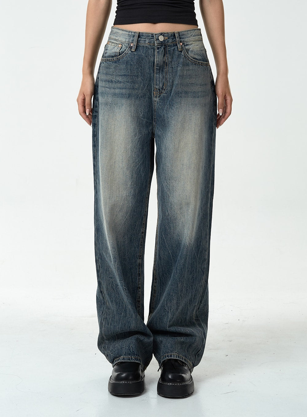 Washed Denim Pants CG10 in dark blue, front waist-to-hem close-up on model, straight wide-leg silhouette with heavy washed fading and vintage crease texture, five-pocket detail.