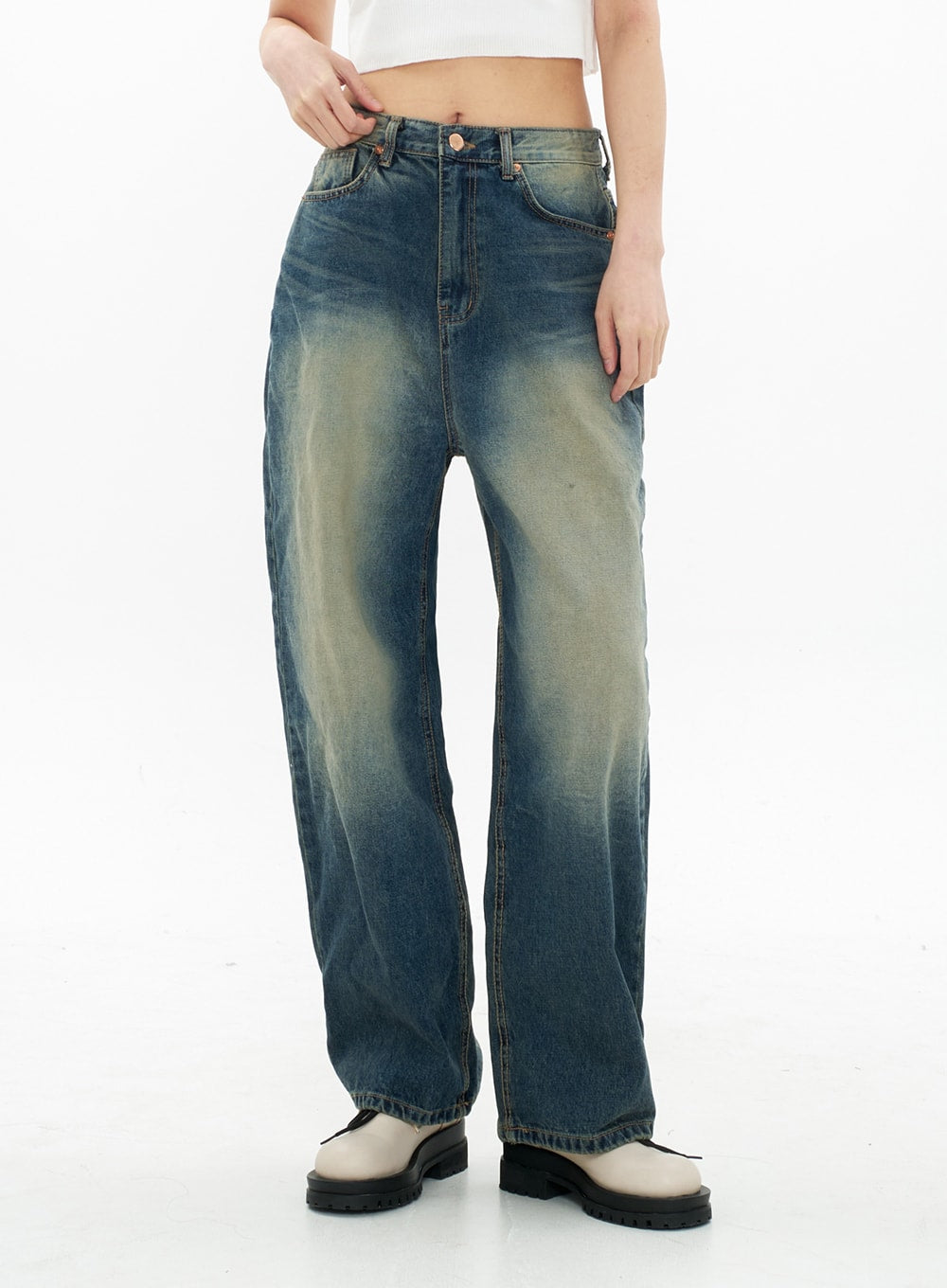 Bleached Wide Leg Denim Pants CA07 in vintage blue, front mid-shot on model, highlighting bleached yellow-toned gradation wash, front pockets, and wide-leg silhouette to ankle.