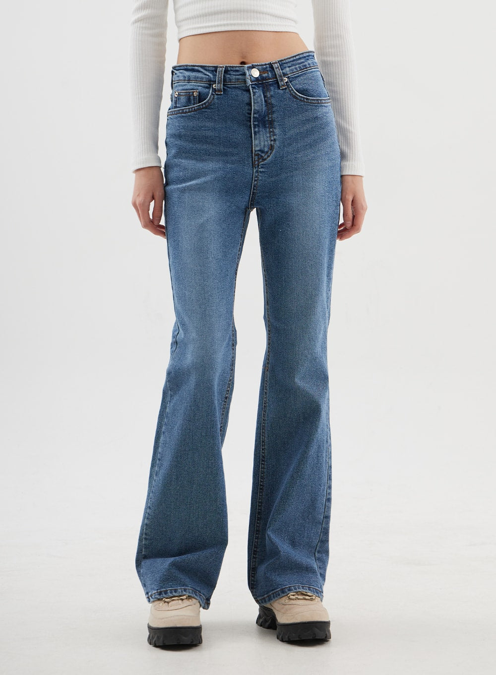 Slim Fit Bootcut Jeans CJ311 in medium blue, front waist-to-hem close-up on model, mid-rise with button closure, five-pocket design, subtle flare at hem, cotton-spandex denim.