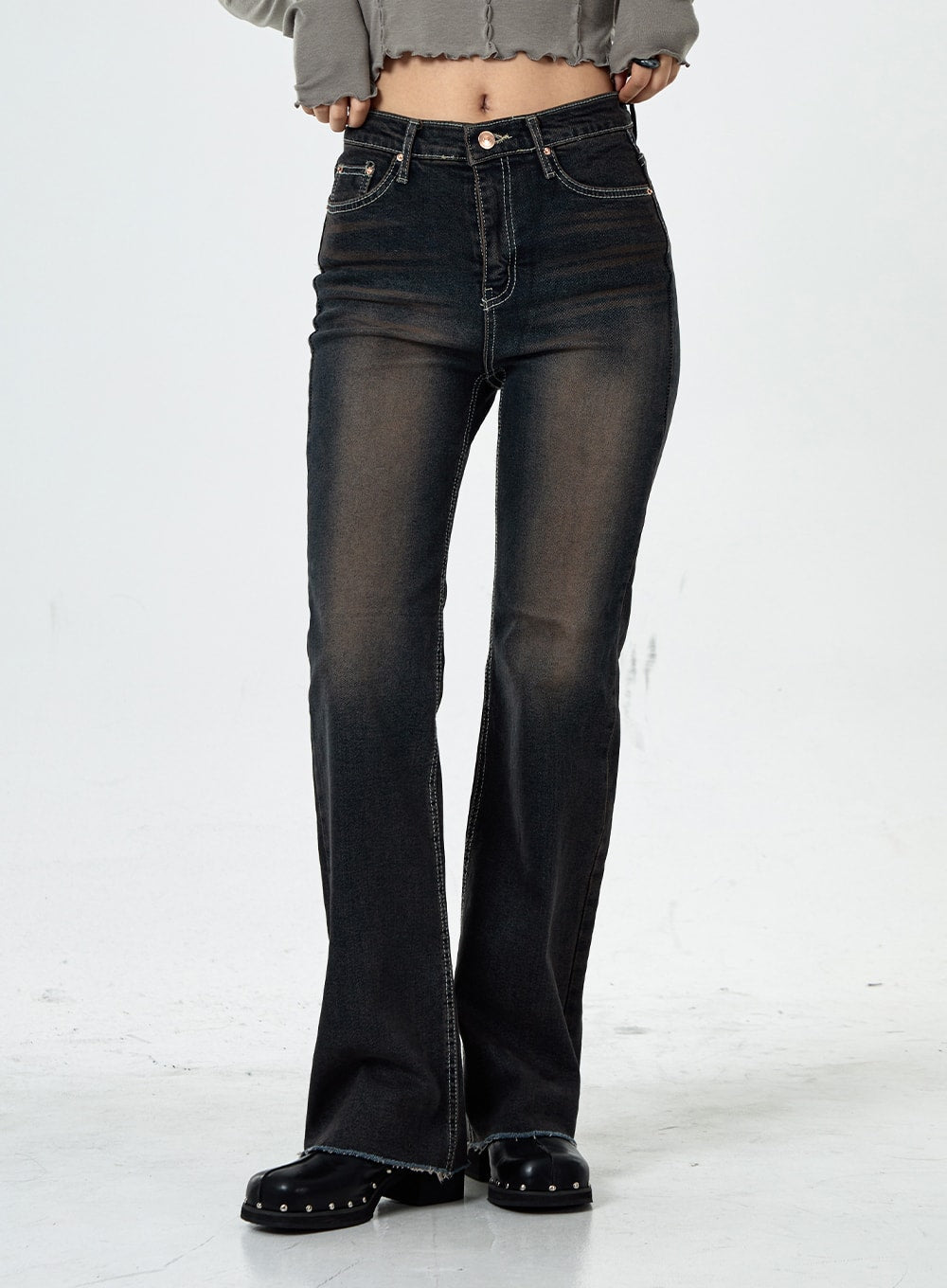 Basic Washed Bootcut Jeans CS07 in black washed denim, waist-to-hem front close-up, high-rise fit, contrast stitching, slim bootcut leg with frayed hem, paired with grey crop top.