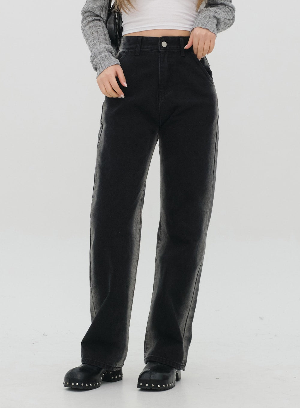 Black Jeans C1002 in washed black, front torso-to-hem shot on model, high-rise waistband with silver button, wide straight leg, side fading detail, styled with grey cardigan.