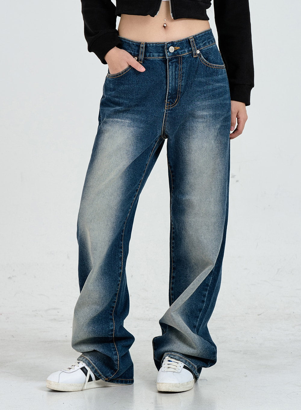 Wide Leg Faded Color Denim Pants CO11 in blue gradation, front close-up from waist to hem on model, high-rise waist, contrast stitching, faded thigh detail, stacked wide leg hem, white sneakers.