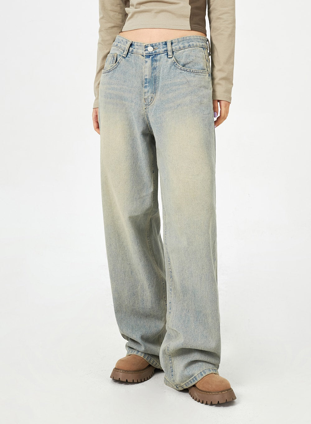 Light Blue Baggy Jeans CM323 in light blue, front mid-shot without model face, low-rise waist with 5-pocket design, wide leg pooling at ankle over chunky shoes.