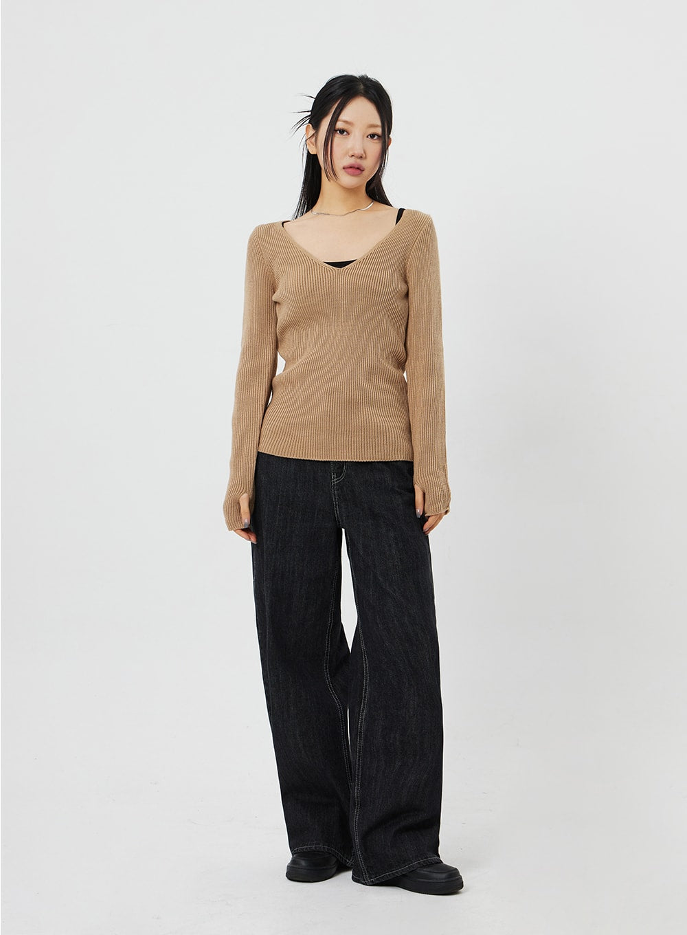 Straight Leg Jeans CF315 in black, full-body front on model, wide-fit straight-leg cotton denim, worn with camel V-neck ribbed knit and black chunky loafers.