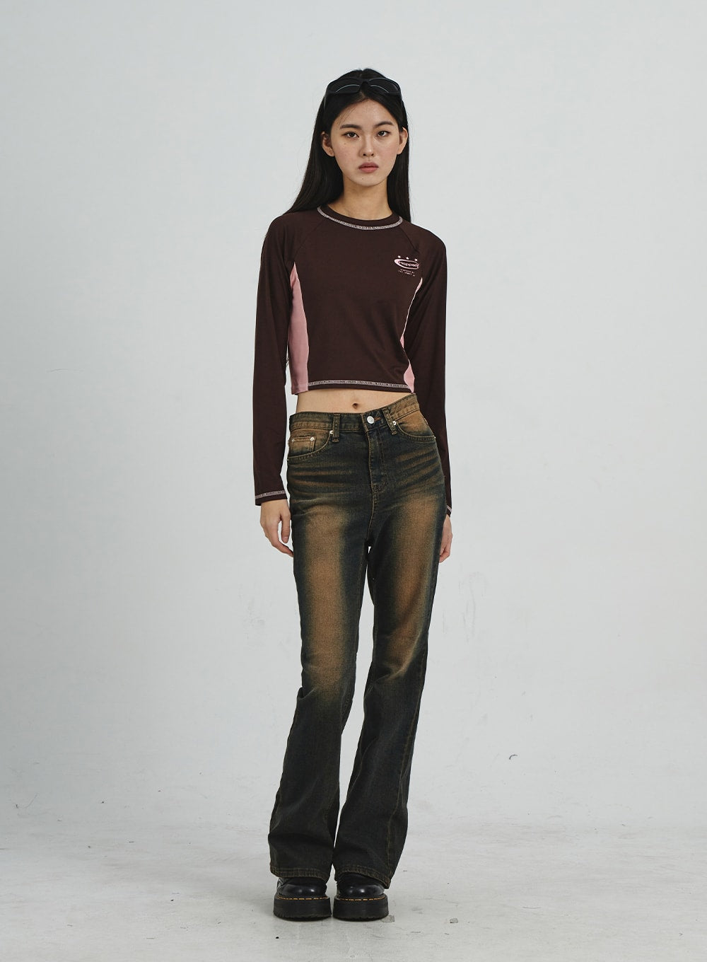 Vintage Washing Bootcut Jeans CD02 in dark washed denim, full-length front view on model, relaxed standing pose showing slim-fit bootcut silhouette and golden-brown washed fading effect.