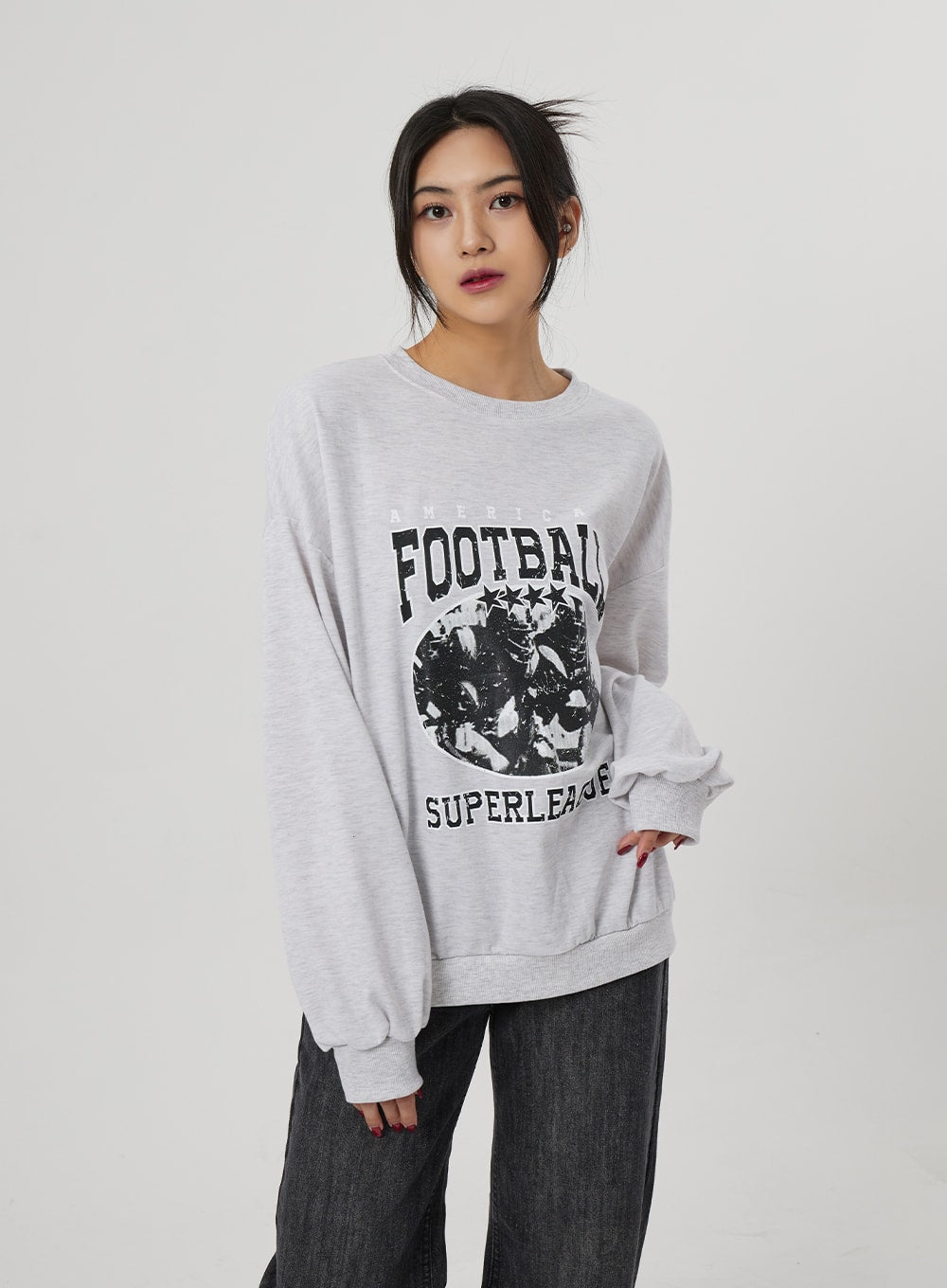 Wide Straight Leg Jeans BF310 in washed black, waist-down side view on model, wide straight leg cotton denim with subtle whisker fading, styled with grey oversized sweatshirt.