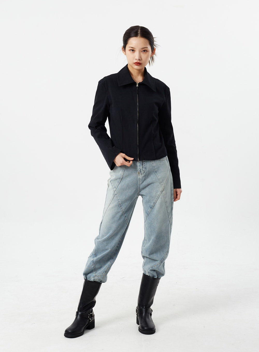Light Wash Straight Leg Jeans CM307 in light blue, full-body front on model with relaxed stance, geometric seam detail on straight-fit cotton denim, layered with black cropped jacket and tall boots.