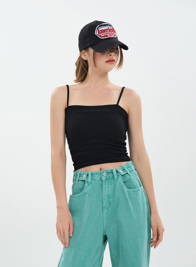 LEWKIN Basic Cropped Cami Top CA20 in black, front view on model, slim spaghetti straps and square neckline, cropped ribbed jersey, styled with teal wide-leg jeans and black cap.