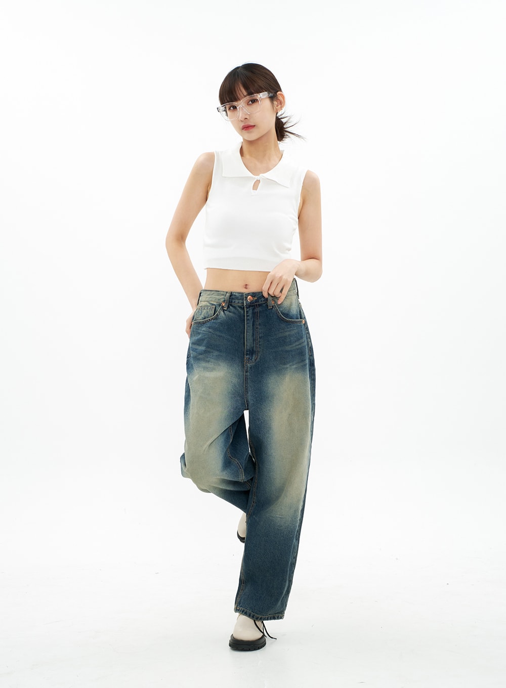 Bleached Wide Leg Denim Pants CA07 in vintage blue, full-body side-angled view on model with one leg raised, showing wide-leg volume and bleached gradation wash on cotton denim.