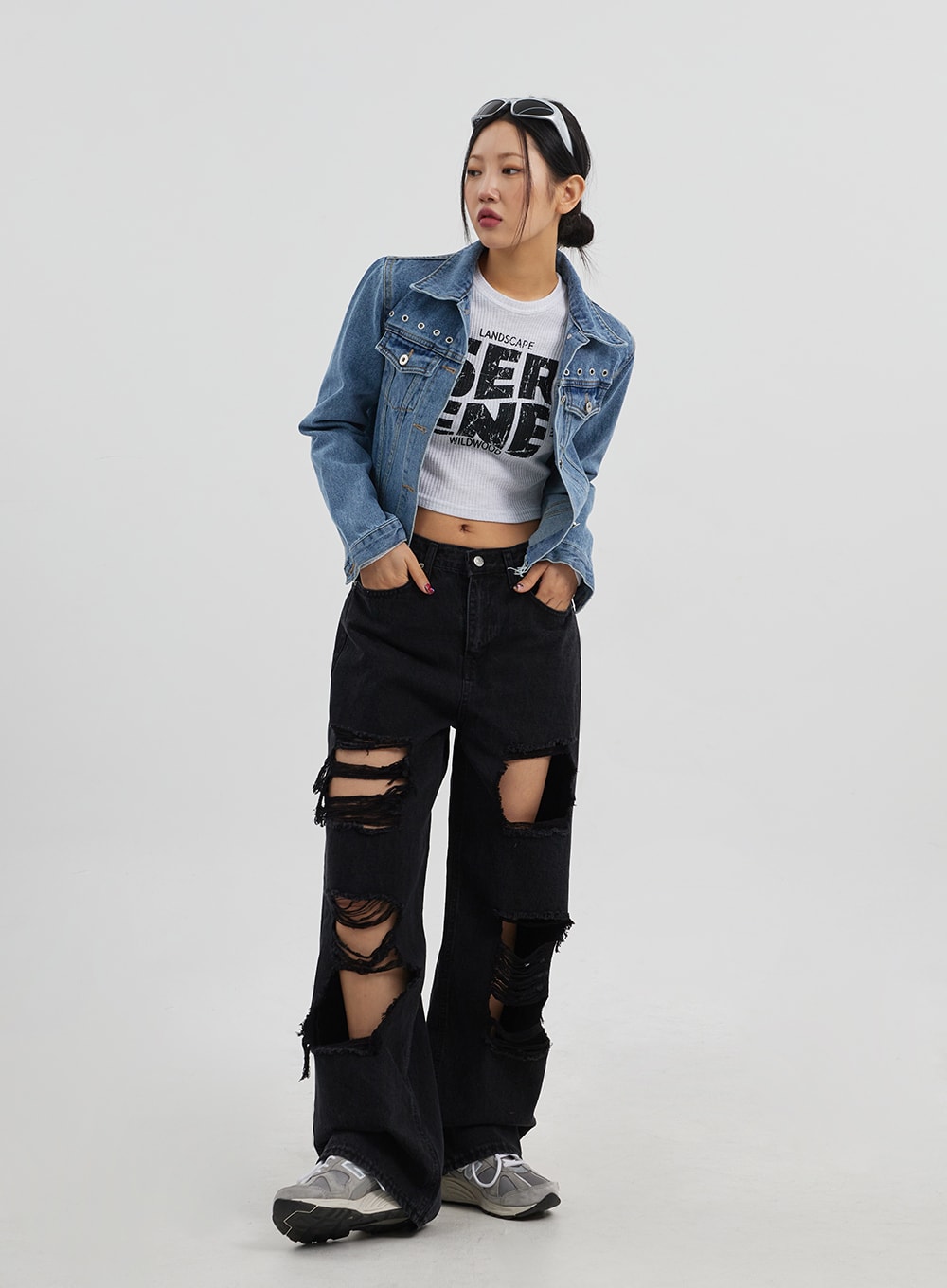 Ripped Wide Leg Jeans CJ319 in black, full-length front on model with hands in pockets, wide-fit destroyed denim with large thigh rips, styled with blue denim jacket and crop tee.