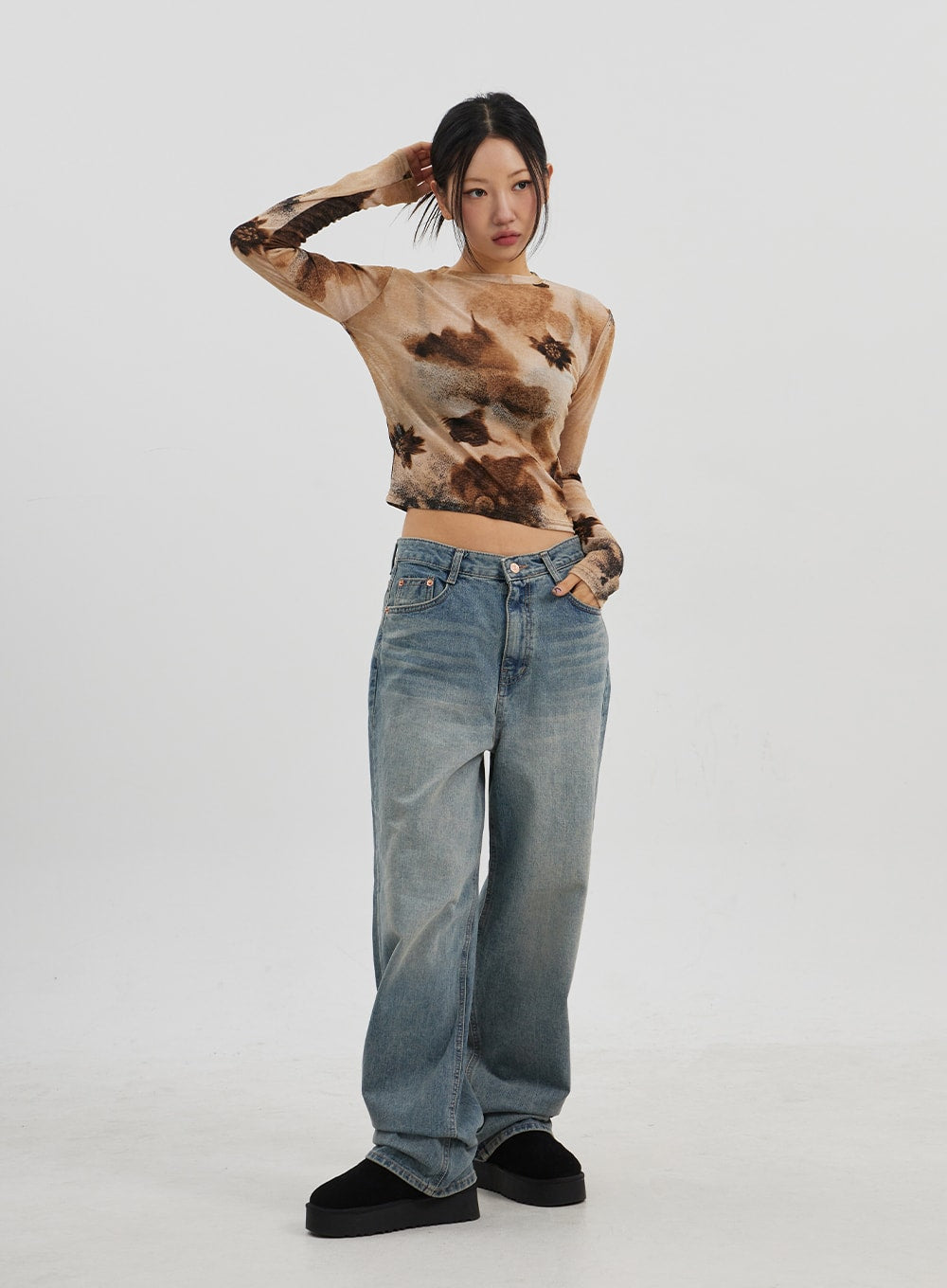 Low Rise Baggy Jeans CJ330 in Blue, full-body front shot on model, relaxed wide-fit faded denim, low-rise waistband visible, paired with tie-dye top and black platform shoes.