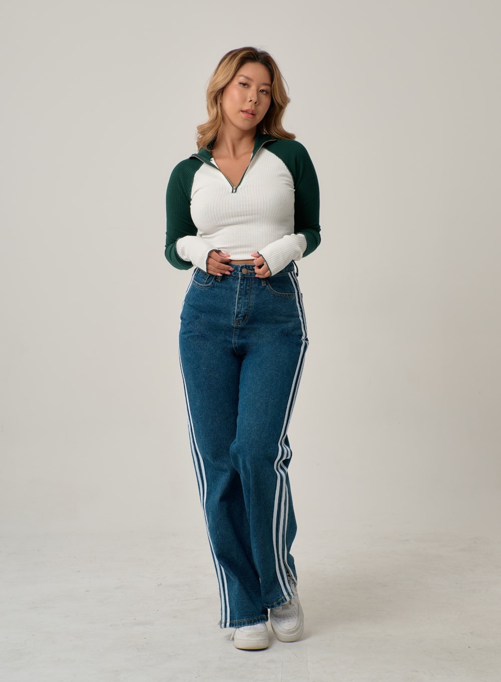 Side Stripes Straight Leg Jeans IN22 in mid blue, full-length front shot on model with hands at waist, high-rise straight leg denim with triple white side stripes, casual sporty styling.
