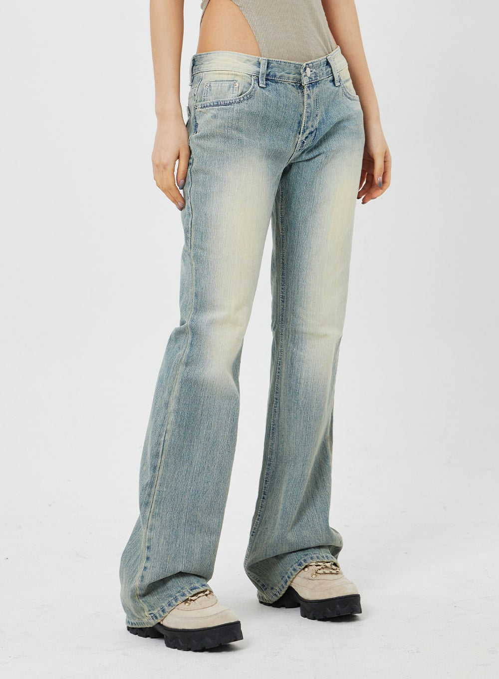 Low Rise Bootcut Jeans CF315 in light blue, side waist-to-ankle close-up on model, low-rise five-pocket construction, subtle bootcut flare with vintage wash detailing.