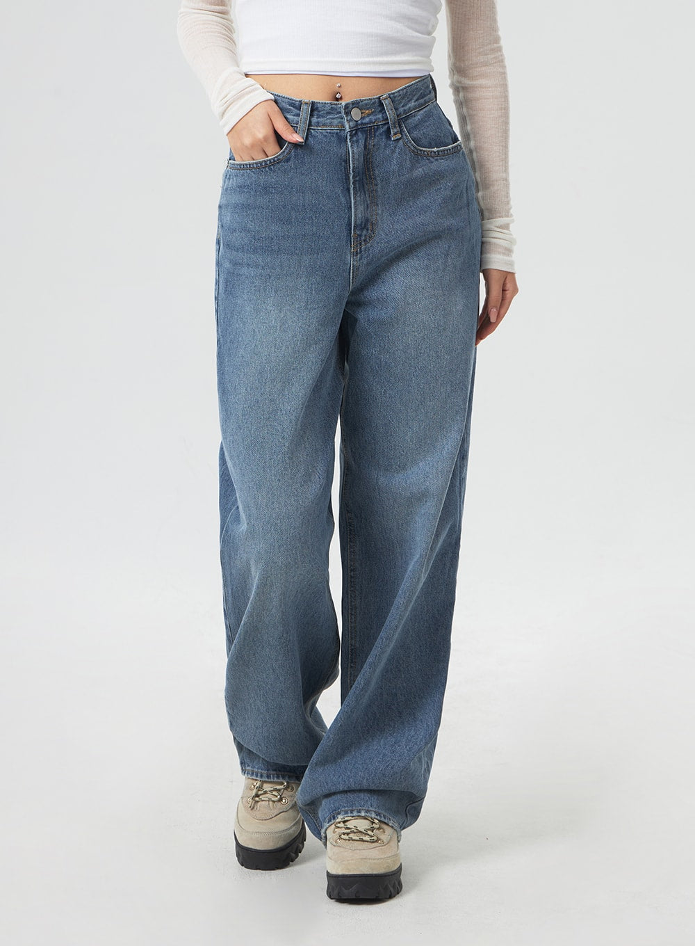Wide Leg Mid-Wash Jeans CM331 in mid-wash blue, front close-up from waist to hem on model, high-rise button closure, wide straight leg, faded wash cotton denim texture visible.