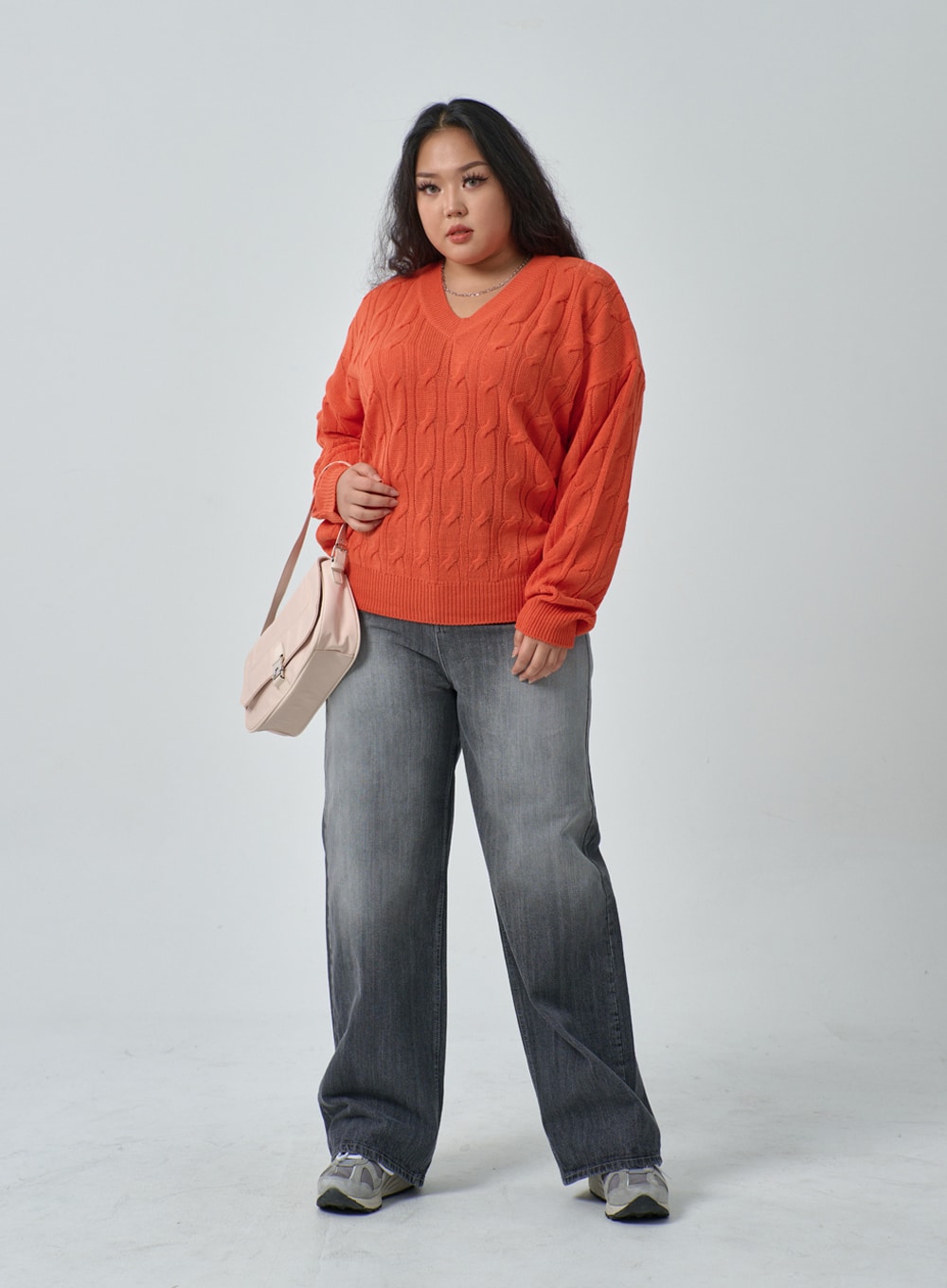 Plus Light Wash Wide Leg Jeans IF317 in grey wash, three-quarter front view on plus-size model, wide fit washed cotton denim, paired with orange cable-knit sweater and beige bag.