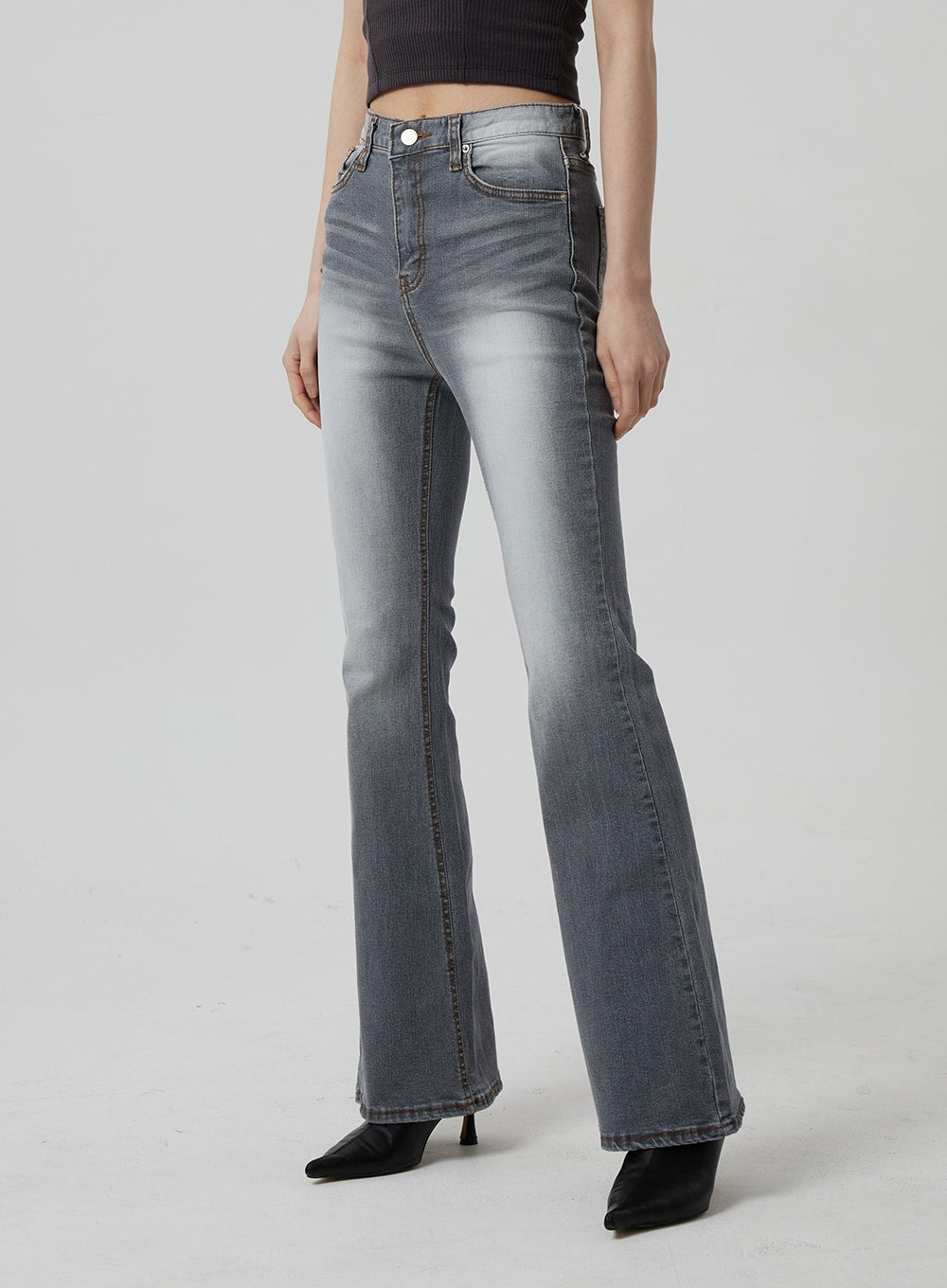 Slim Fit Bootcut Jeans CF307 in grey, angled front three-quarter view waist-to-hem on model, high-rise with subtle whisker fading, five-pocket design, slim bootcut silhouette.