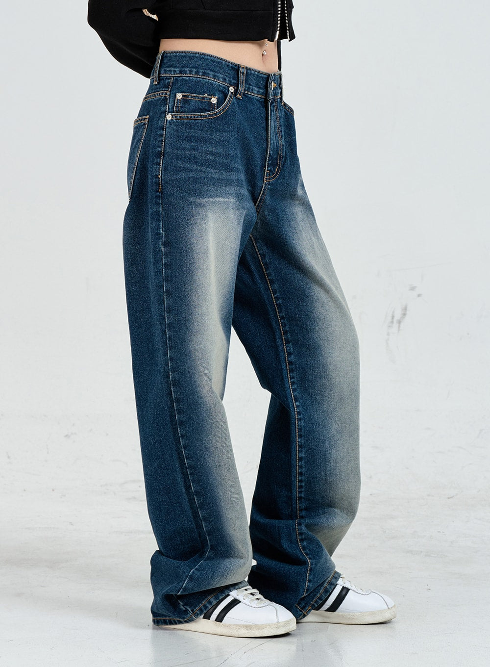 Wide Leg Faded Color Denim Pants CO11 in blue gradation, side view close-up from waist to hem on model, five-pocket construction, faded panel detail on thigh, wide straight leg pooling at ankle.
