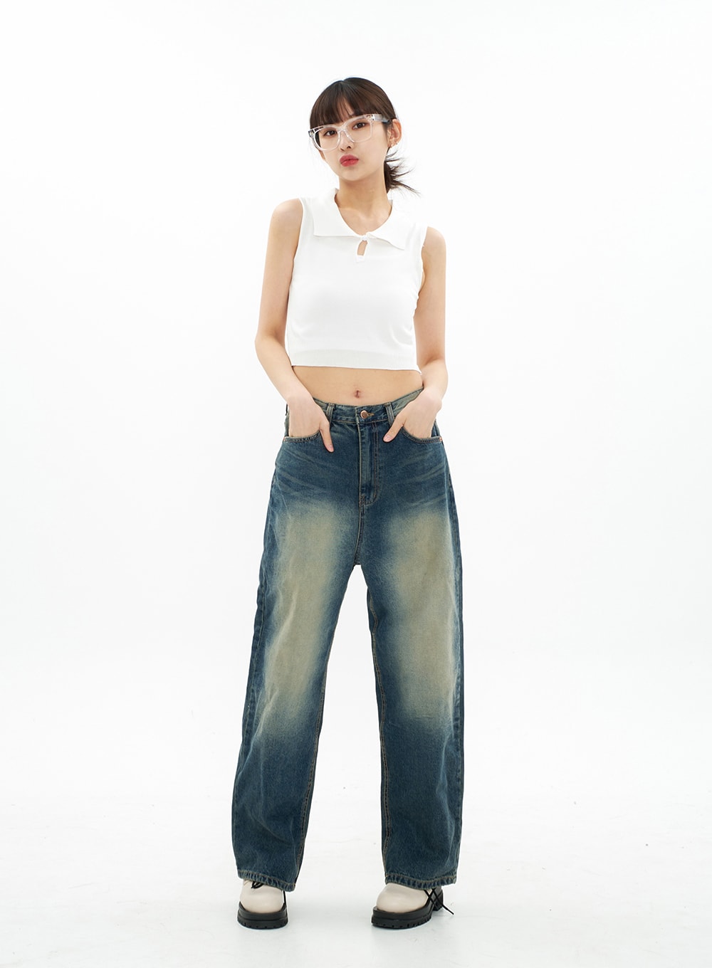 Bleached Wide Leg Denim Pants CA07 in vintage blue, full-body front view on model hands in pockets, relaxed wide fit with prominent yellow bleach gradation at thighs, long length to floor.