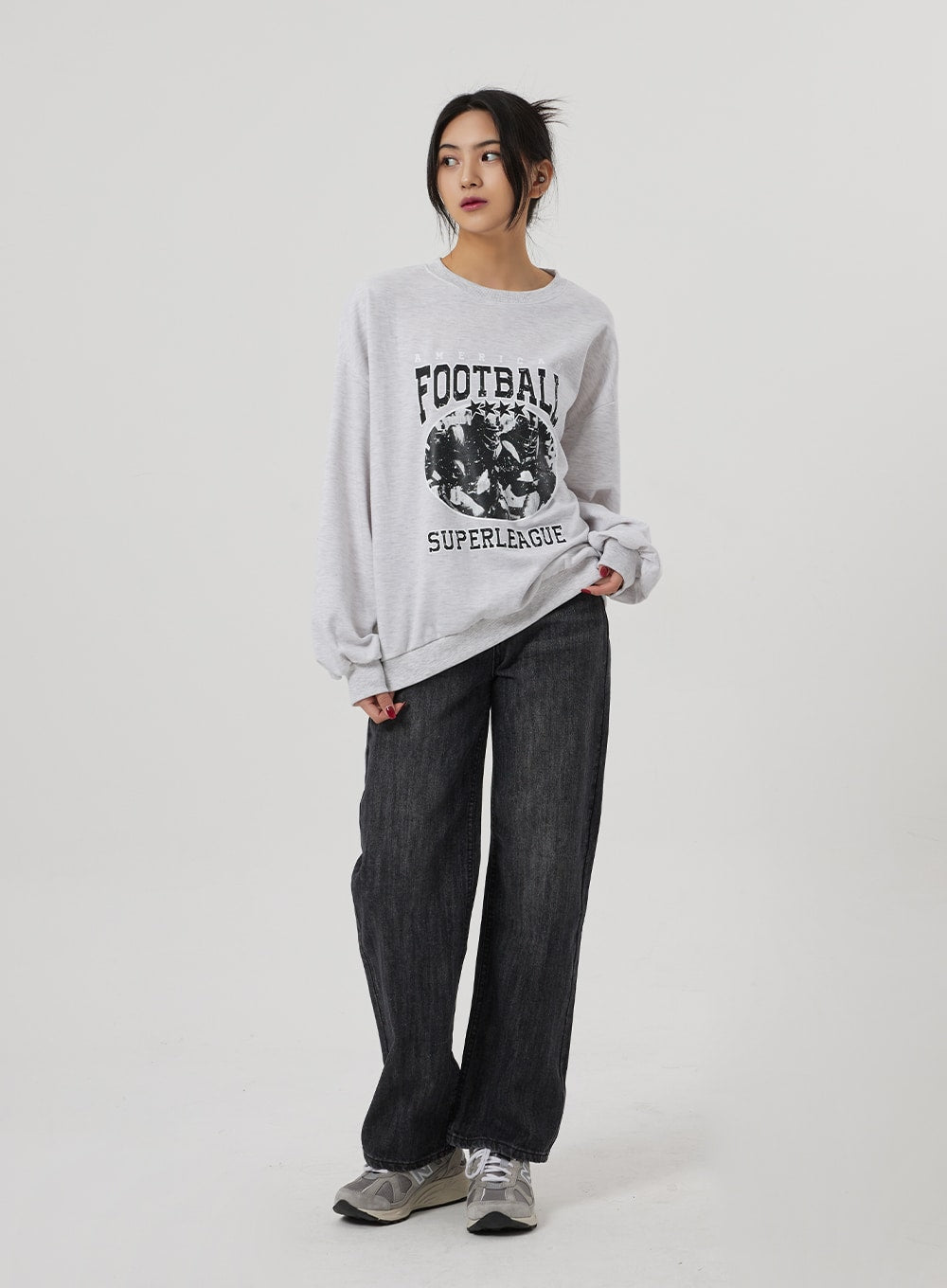 LEWKIN Wide Straight Leg Jeans BF310 in washed black, full-length front view on model, wide-fit cotton denim with relaxed straight leg, paired with grey graphic sweatshirt and sneakers.