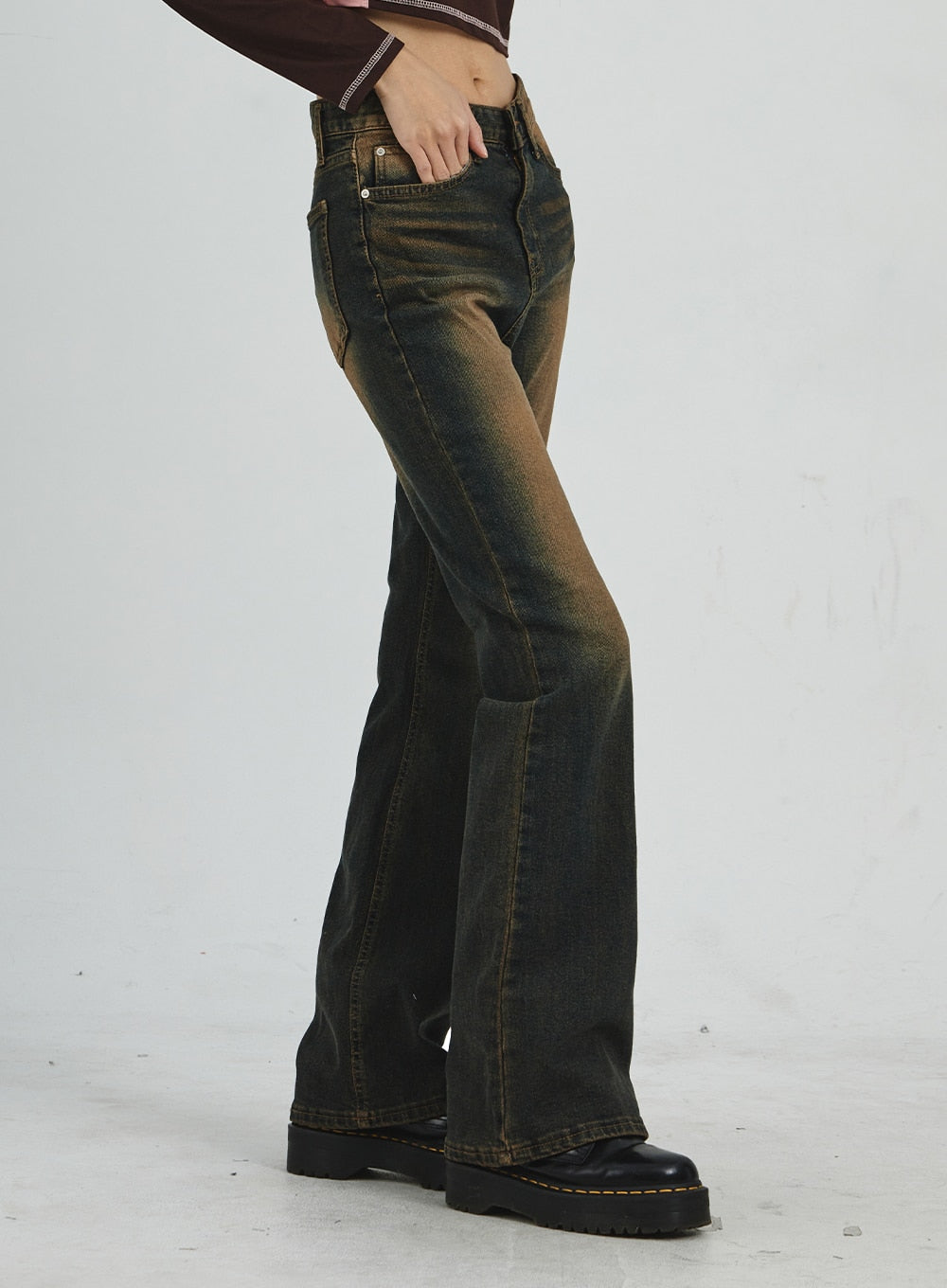 Vintage Washing Bootcut Jeans CD02 in dark washed denim, side view close-up waist-to-hem on model, showing slim-fit profile, amber vintage wash on thigh, and subtle bootcut flare at hem.
