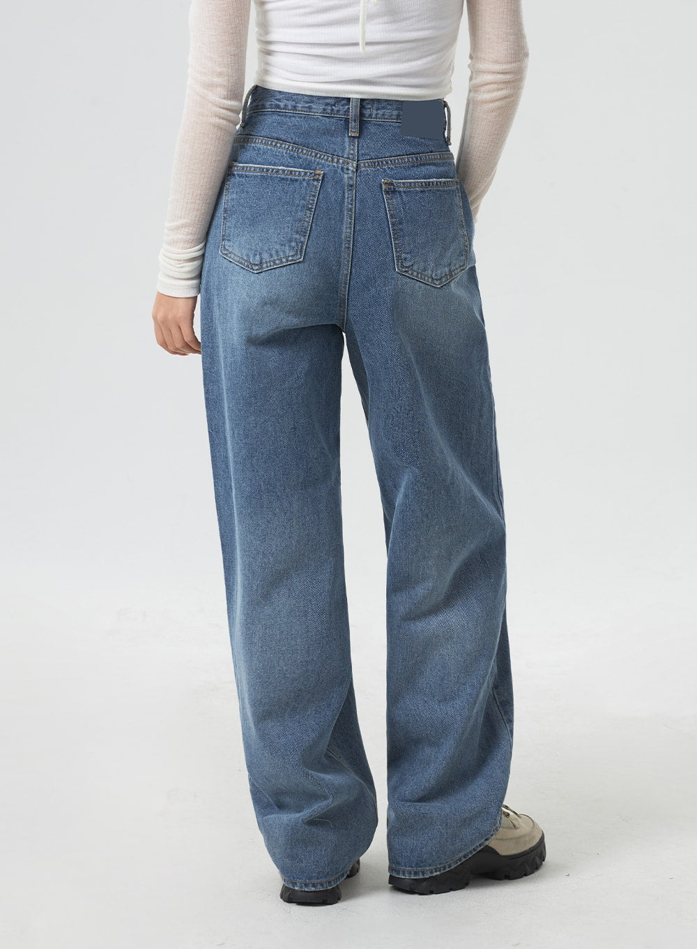 Wide Leg Mid-Wash Jeans CM331 in mid-wash blue, back view from waist to ankle on model, dual back patch pockets with stitching, relaxed wide leg, mid-wash denim finish.