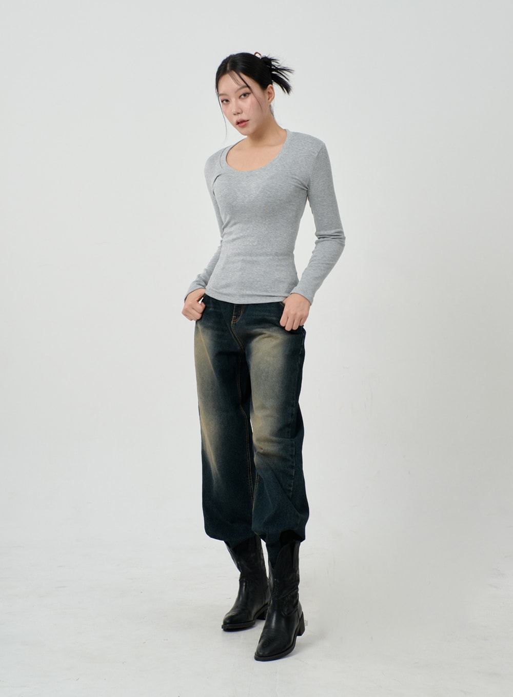 Vintage Washing Baggy Jeans ID23 in dark indigo, full-body front on model hands in pockets, exaggerated wide fit with bold vintage fade wash, paired with grey fitted long-sleeve top and black boots.