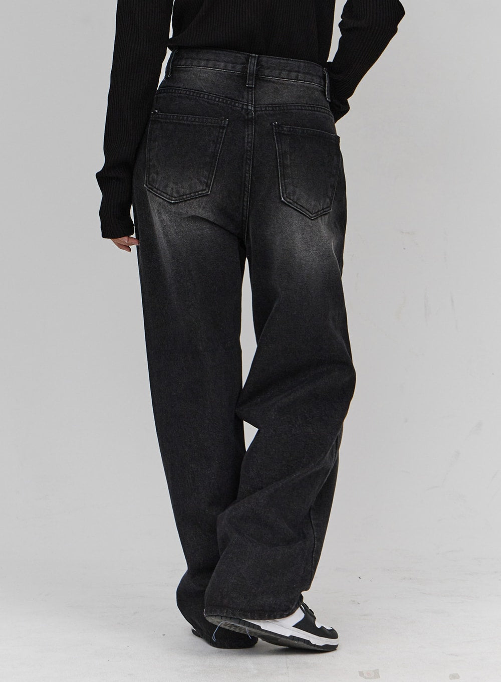 Light Washing Wide Leg Black Jeans CN23 in washed black, back close-up on model, showing dual back pockets with stitching, faded wash detail, wide leg cotton denim.