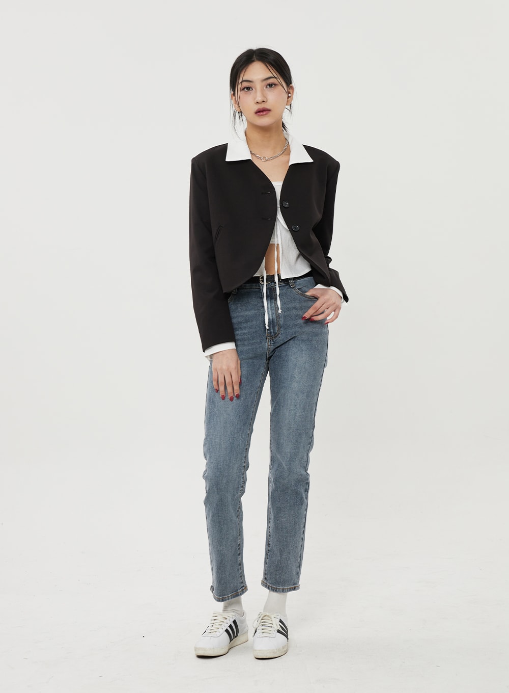 Straight Leg Ankle Jeans BF316 in mid-blue wash, front full-body on model, slim straight leg and ankle length shown in street outfit with black cropped blazer and white top, sneakers.