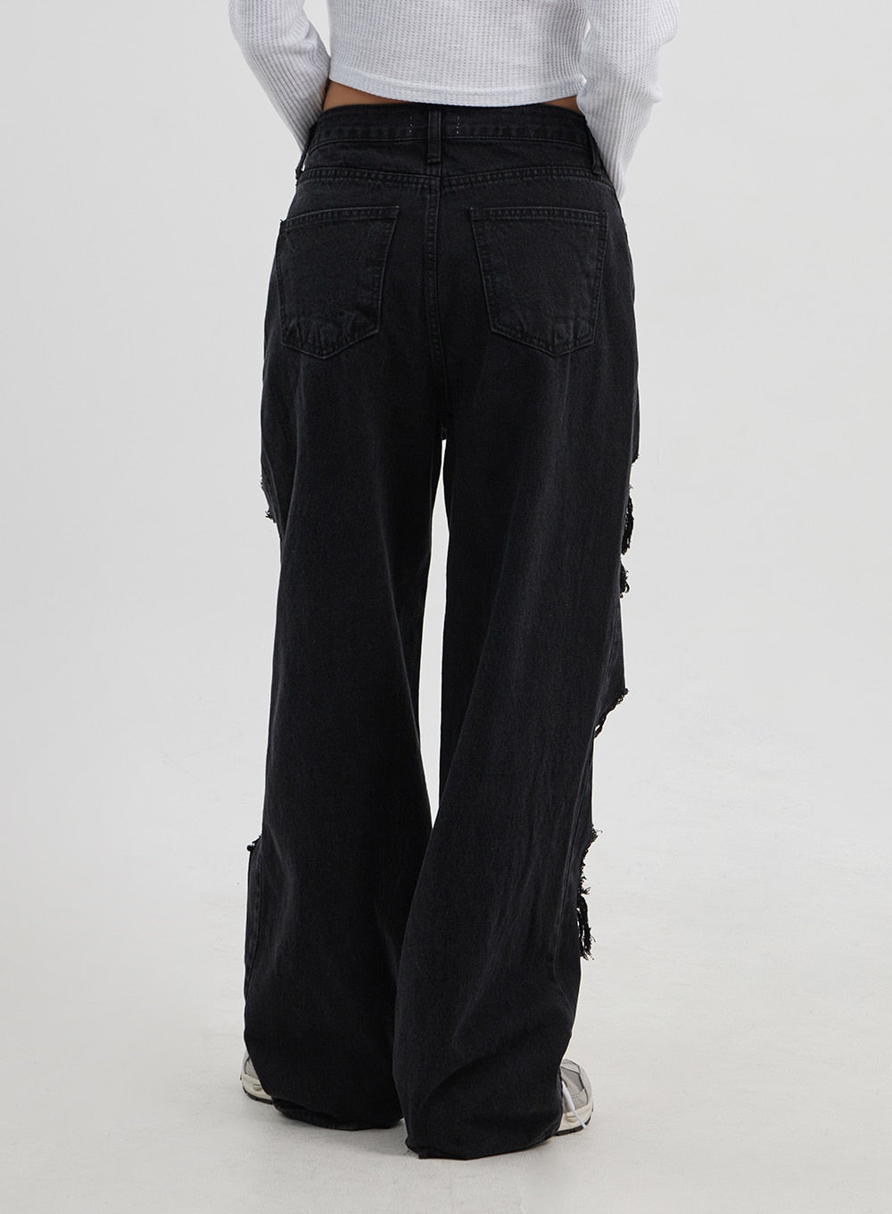 Ripped Wide Leg Jeans CJ319 in black, back view on model, rear five-pocket detail with side rip distressing visible, wide-leg silhouette in washed cotton denim.