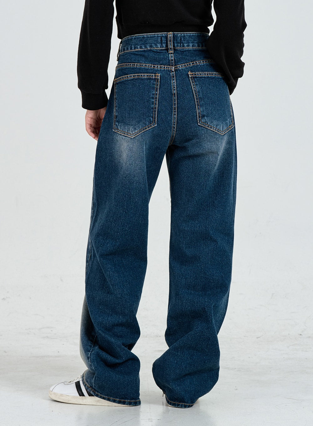 Wide Leg Faded Color Denim Pants CO11 in blue gradation, back view from waist to hem on model, two back patch pockets with contrast stitching, wide cotton leg, faded wash visible on back panel.