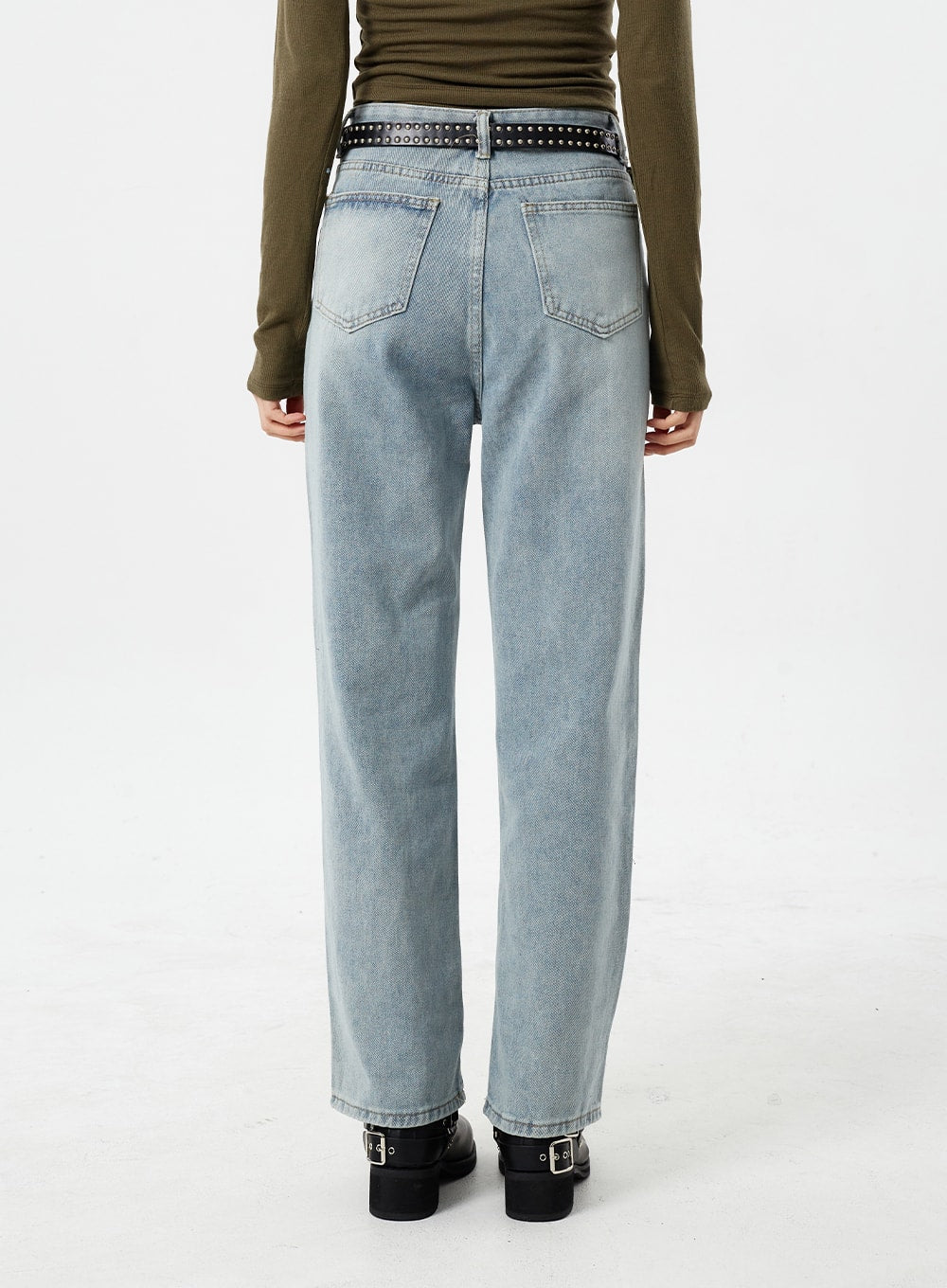 Light Wash Straight Leg Jeans CM307 in light blue, back view waist-to-hem on model, clean five-pocket silhouette, straight-fit washed cotton, styled with studded belt and moto boots.