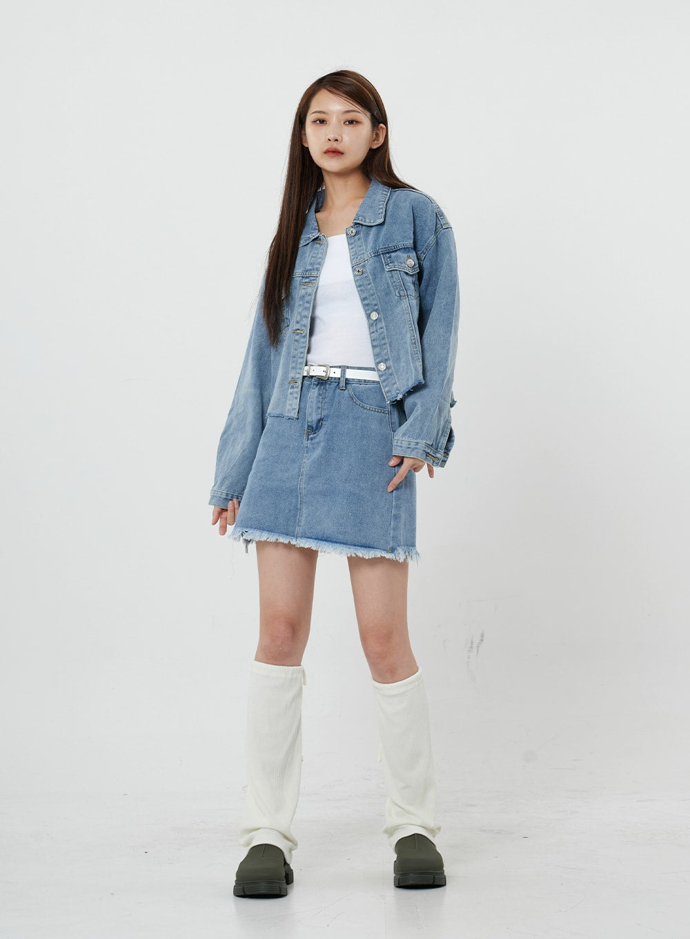 Sienna Crop Jeans Jacket CS21 in light blue, full-length front view on model, open-front crop denim jacket with collar, layered over white tank and denim mini skirt with white knee boots.