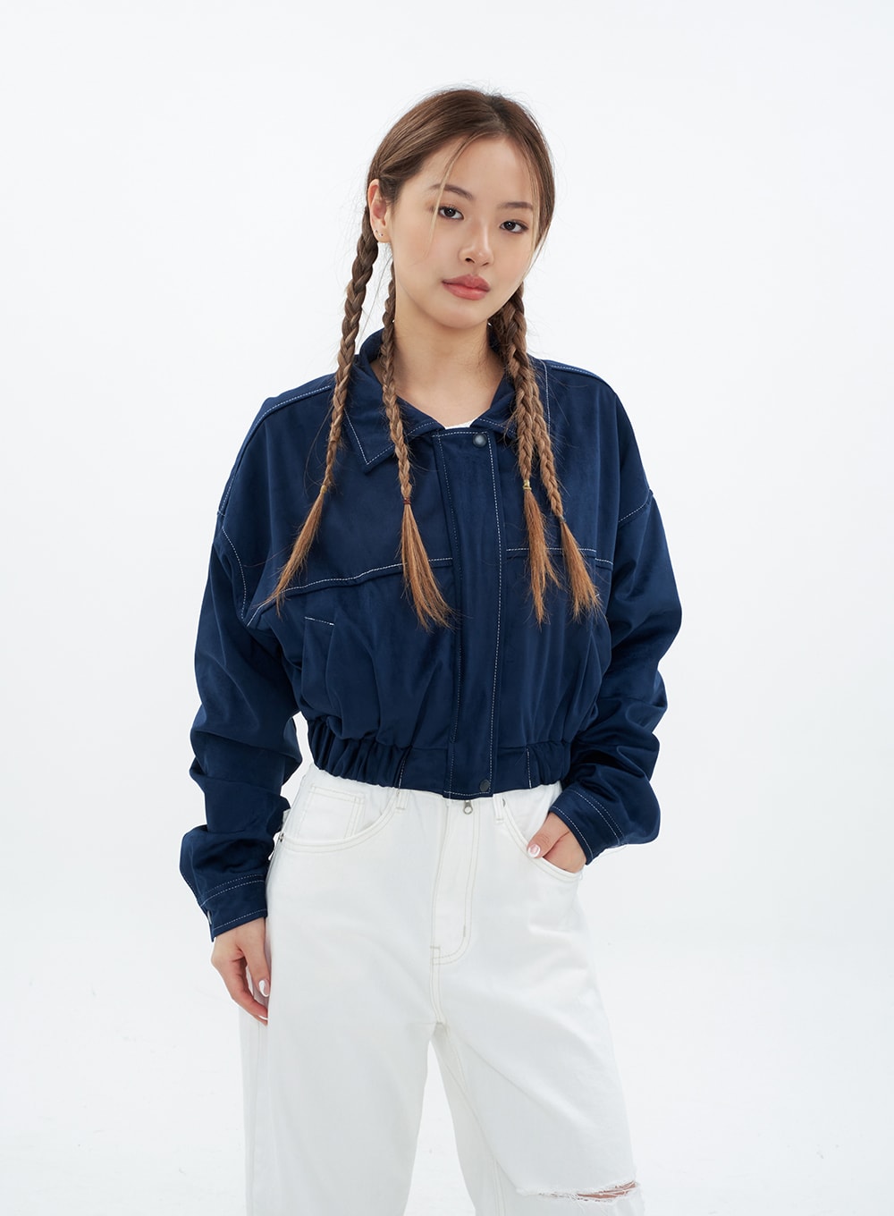 Torn Wide Leg Jeans CM18 in white, front upper-body shot on model, waistband and front pocket detail with contrast stitching visible, knee cut-out partially shown, styled under navy cropped jacket.