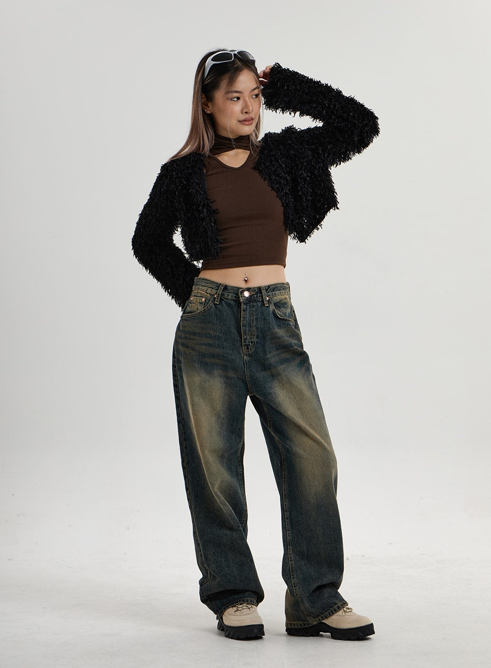 Vintage Washing Wide Leg Denim Pants CN14 in vintage washed indigo, full-body angled front on model, wide-fit denim with street-style yellow fade, paired with black shaggy crop cardigan and chunky shoes.
