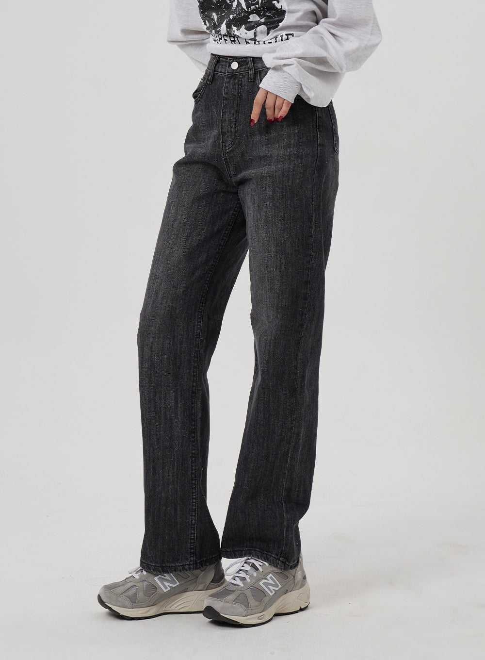 Wide Straight Leg Jeans BF310 in washed black, front side-angle mid-shot on model, high-waist wide straight leg cotton denim with subtle fading, styled with New Balance sneakers.