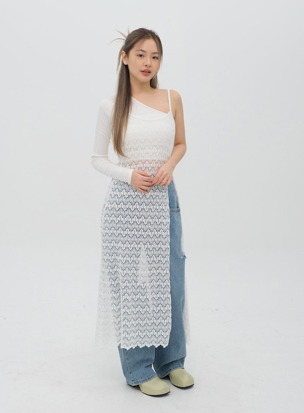 Torn Wide Leg Jeans C1002 in light blue, front three-quarter standing shot on model, wide-leg cotton denim with knee rip and cutout, paired with white lace midi dress.