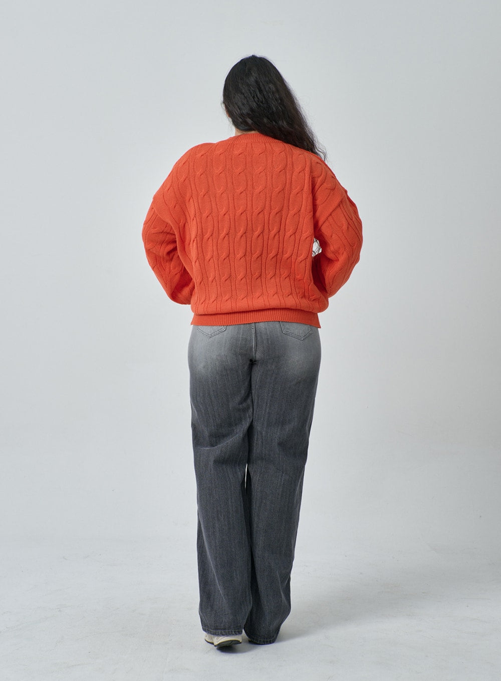 Plus Light Wash Wide Leg Jeans IF317 in grey wash, back full-length view on plus-size model, wide leg cotton denim with faded wash and back yoke seam, paired with orange cable-knit sweater.