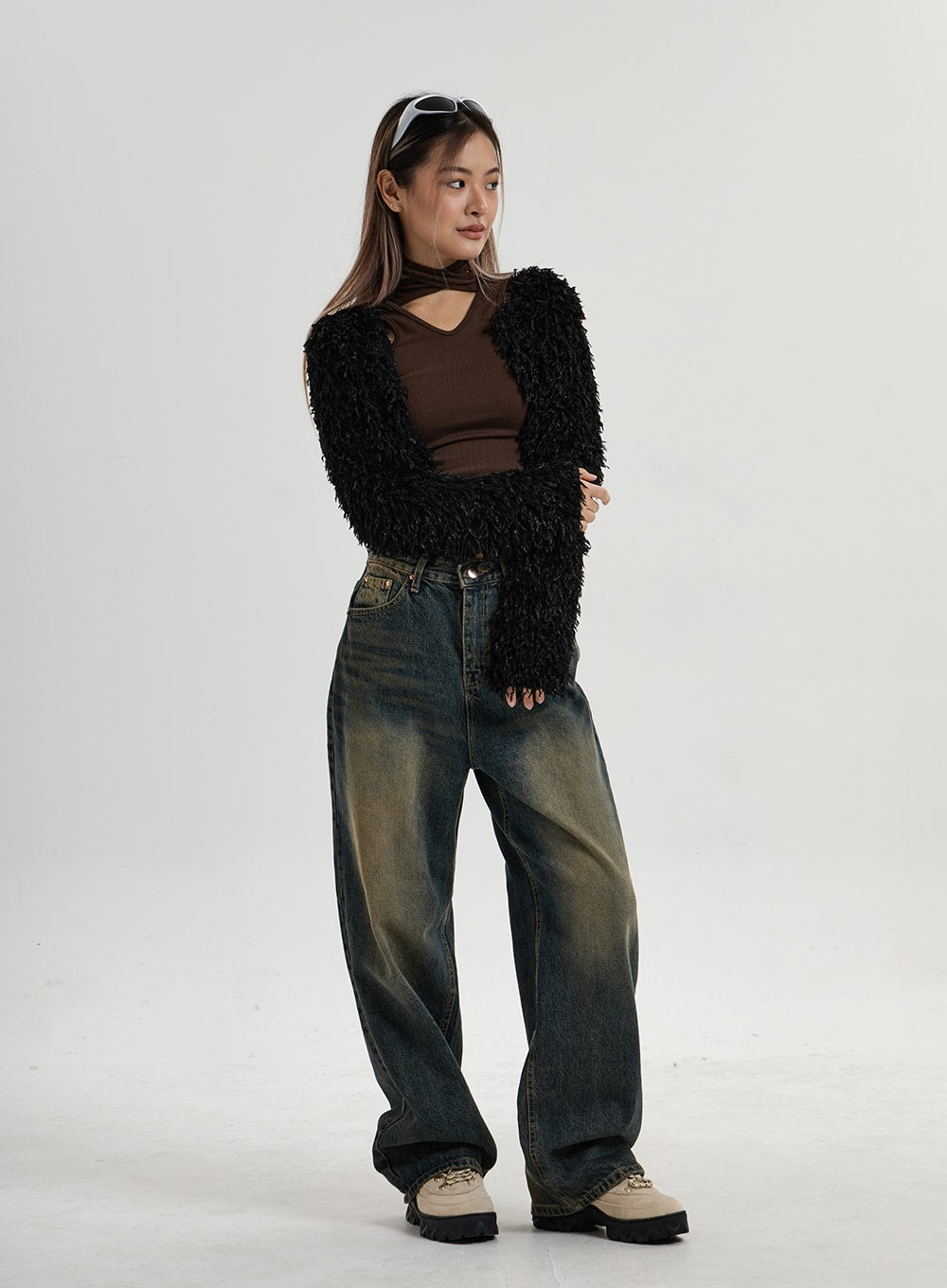 Vintage Washing Wide Leg Denim Pants CN14 in vintage washed indigo, full-body side angle on model with arms crossed, wide leg denim with contrasting yellow-brown vintage wash, relaxed street fit.