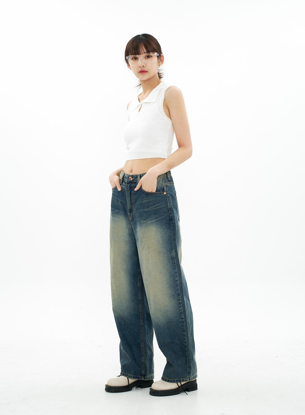 Bleached Wide Leg Denim Pants CA07 in vintage blue, full-body side-angled view on model hands in pockets, wide-leg silhouette from hip to hem with bleached gradation, casual styling.
