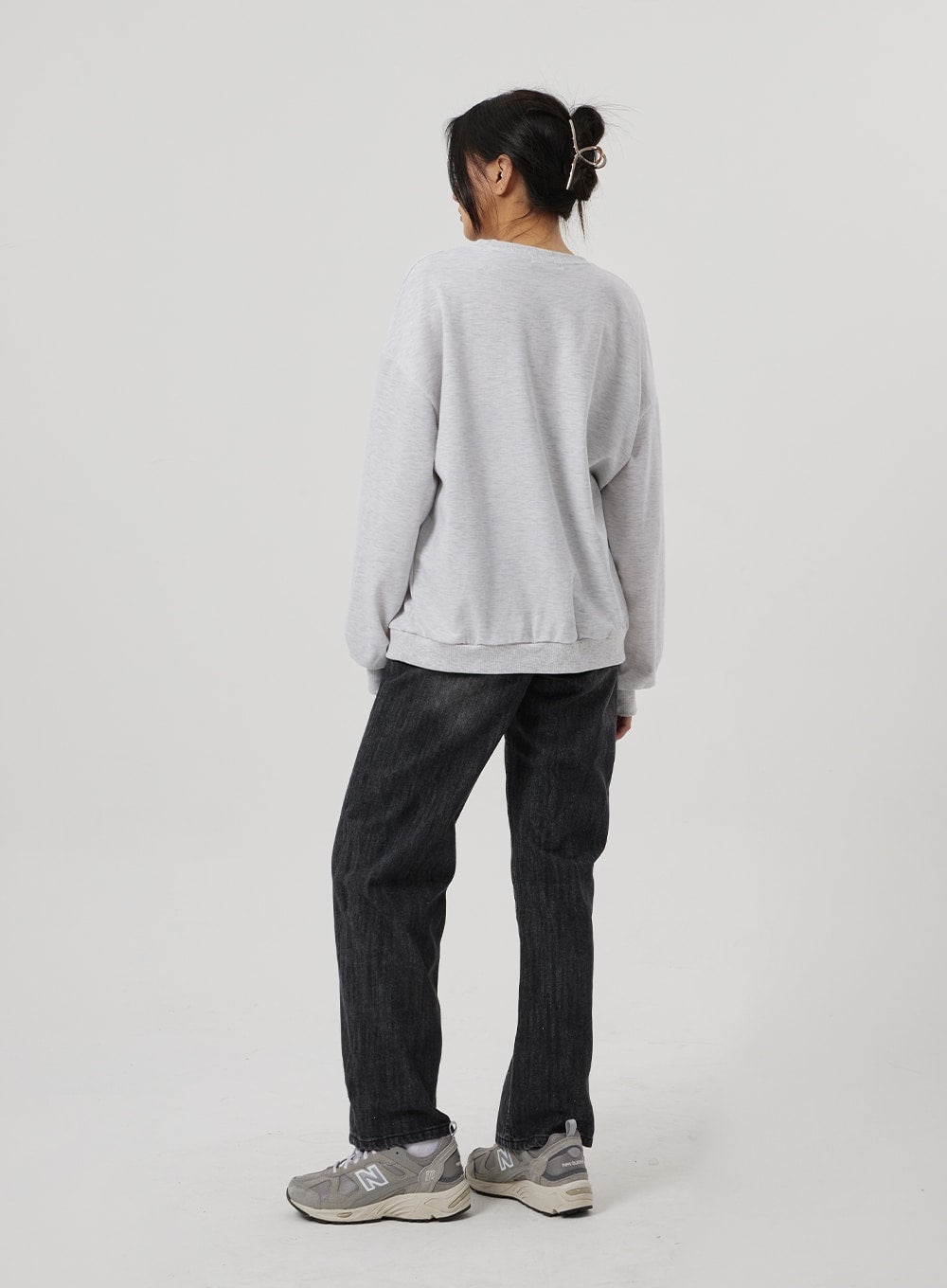 Wide Straight Leg Jeans BF310 in washed black, full-length back view on model, wide straight leg cotton denim showing clean silhouette, styled with grey sweatshirt and chunky sneakers.
