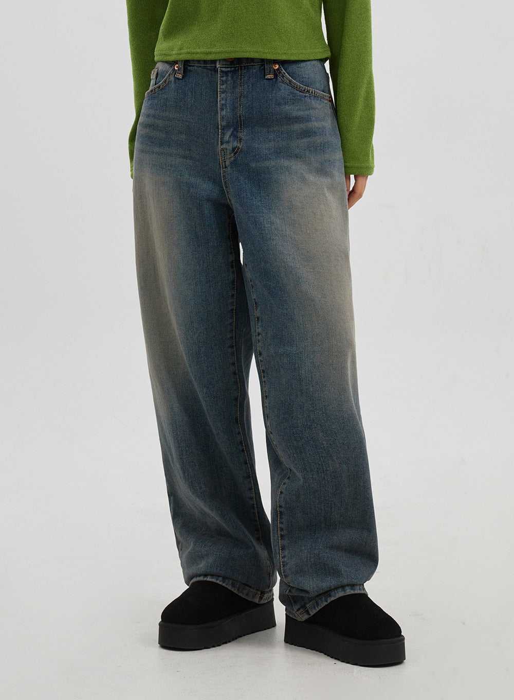 Mid-Rise Baggy Jeans Unisex CJ330 in vintage blue, front waist-to-hem close-up on model, wide-leg denim with mid-rise waistband, visible fading gradient, and relaxed drape.