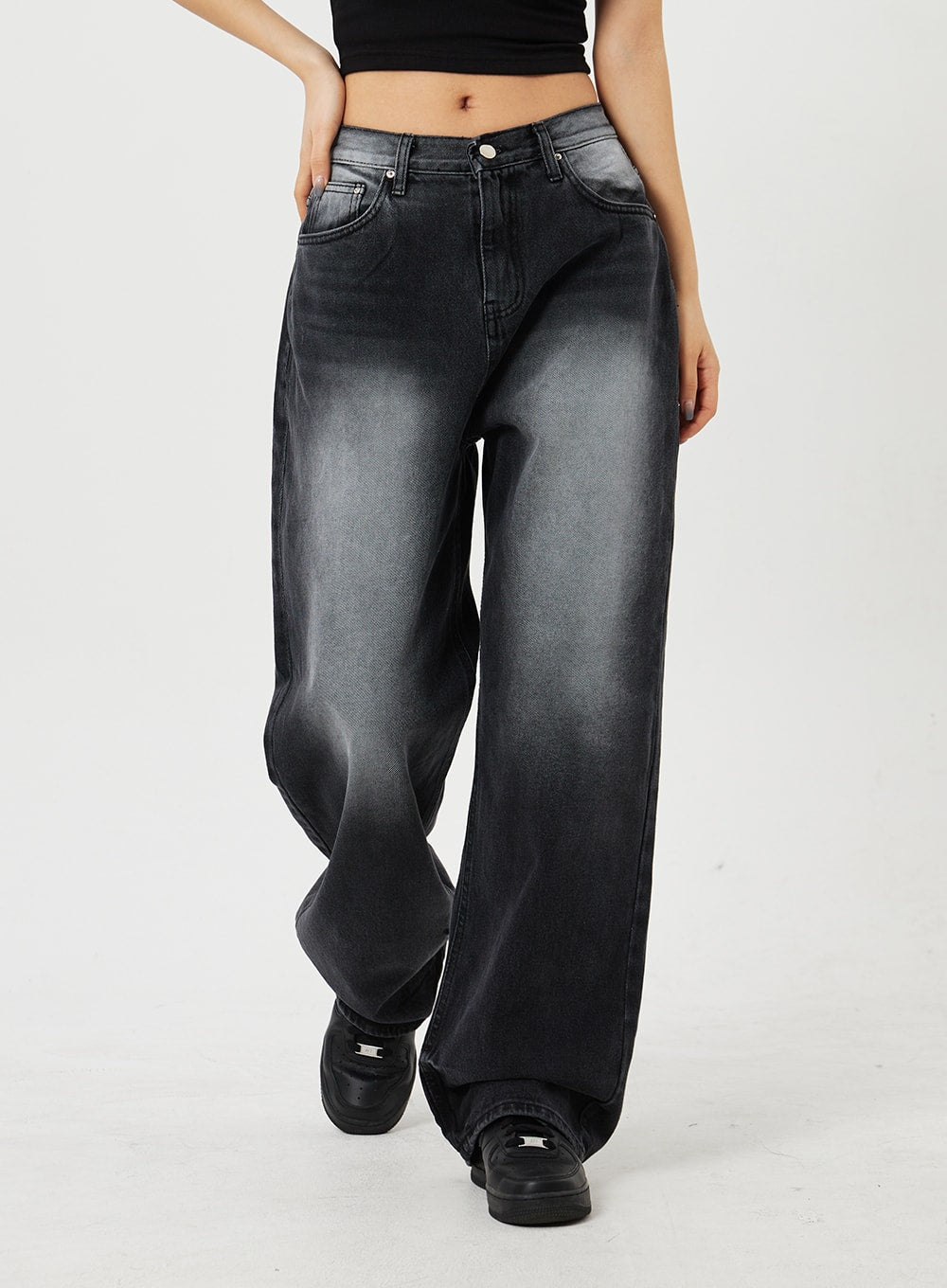 Mid-Rise Baggy Jeans CF328 in black, front straight-on waist-to-ankle view on model, wide-fit washed cotton denim with subtle fading across thighs, mid-rise button closure visible.