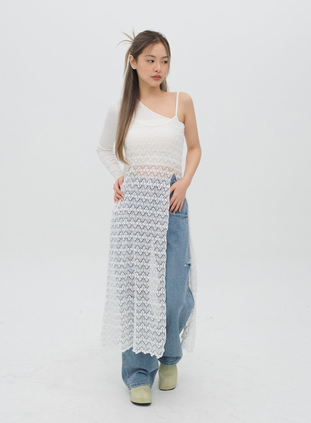 Torn Wide Leg Jeans C1002 in light blue, front slight-angle standing shot on model, hand-on-hip pose showing high-rise waist and destroyed knee cutout, white lace overlay.