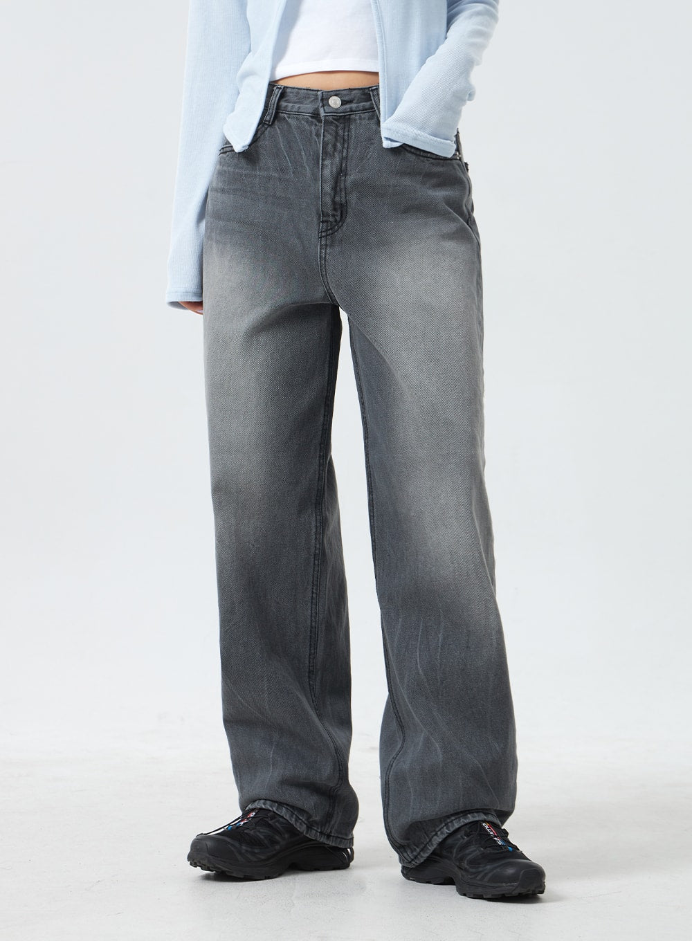Low Rise Mid-Wash Jeans CM327 in grey, front waist-to-ankle close-up on model, wider leg opening visible, low-rise cotton denim with faded mid-wash texture and subtle whisker creasing.